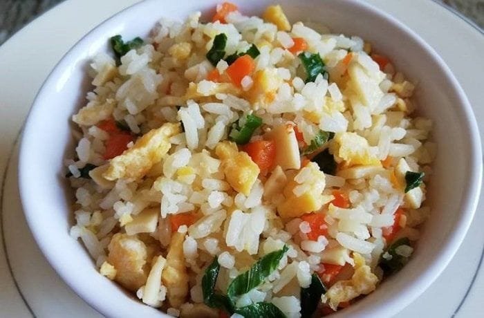 Homemade arroz chaufán with egg, turkey ham, and scallions