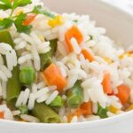 Chilean arroz primavera, fluffy long grain rice mixed with colorful vegetables