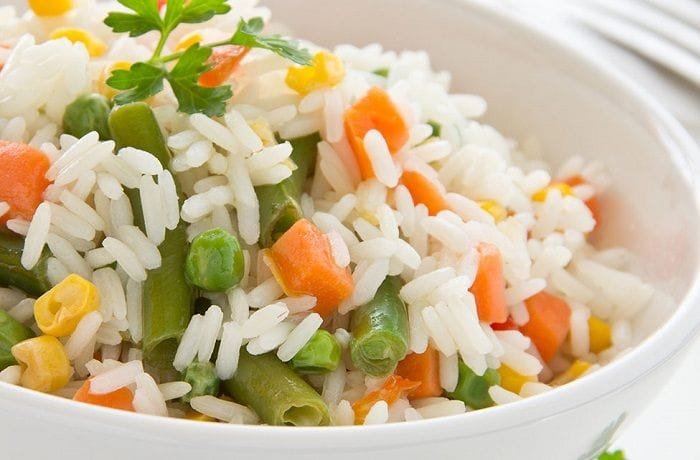 Chilean arroz primavera, fluffy long grain rice mixed with colorful vegetables