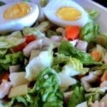 Chilean salpicon with diced beef, potato, carrot, and egg on lettuce