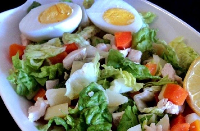 Chilean salpicon with diced beef, potato, carrot, and egg on lettuce