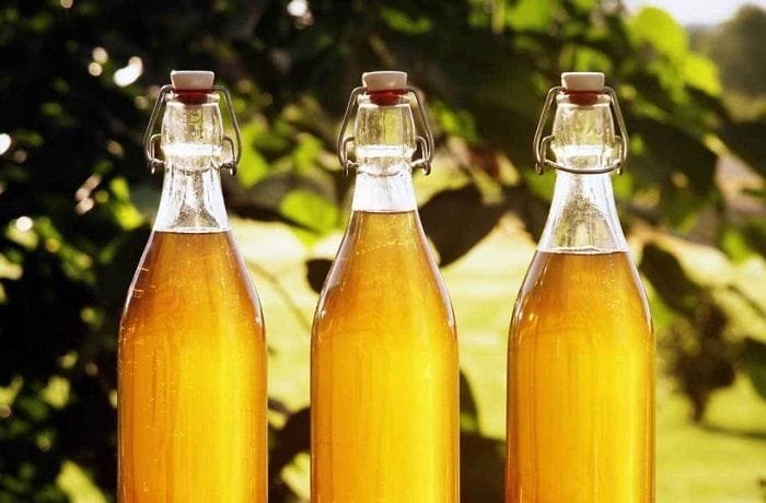 Bottles of traditional Chilean beeswax chicha, an amber drink from the Alto Biobio served cold