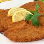 Chilean fried beef escalopa, breaded thin beef cutlet served hot