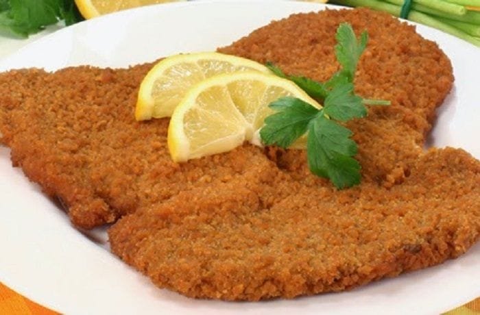 Chilean fried beef escalopa, breaded thin beef cutlet served hot