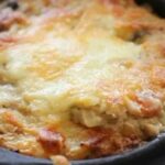 Chilean canned jack mackerel chupe, creamy and gratinated, served in a clay bowl