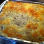 Baked Chilean canned jack mackerel loaf with a golden top, served on a glass dish.