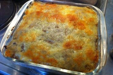 Baked Chilean canned jack mackerel loaf with a golden top, served on a glass dish.