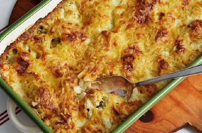 Chilean cauliflower and cheese budin, golden and gratinated, fresh from the oven and cut into portions