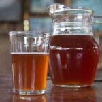Chilean chicha de uva from Curacavi, a naturally fermented grape drink served in a glass pitcher.