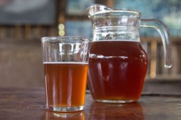 Chilean chicha de uva from Curacavi, a naturally fermented grape drink served in a glass pitcher.