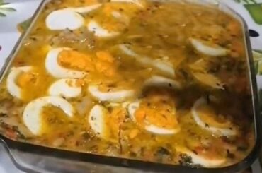 Chilean chicken feet head cheese with a firm jellied texture, carrot, cilantro, and visible pieces of hard-boiled egg