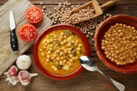 Chilean chickpea stew with squash and tomato in a deep bowl