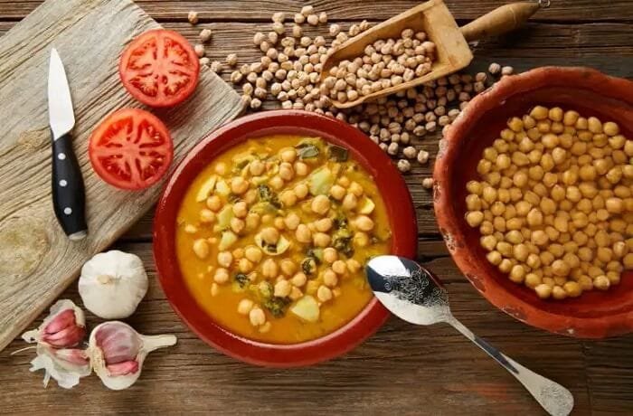 Chilean chickpea stew with squash and tomato in a deep bowl