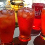 Chilean chuflay cocktail, aguardiente topped with soda in a tall glass with ice