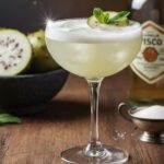 A chilled glass of Chilean copao sour cocktail made with desert cactus fruit and pisco.