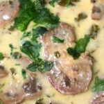Chilean beef kidneys in a thick creamy sauce with fresh cilantro