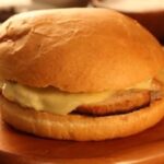 Chilean diplomático sandwich on pan frica with thin pork loin and melted chanco cheese