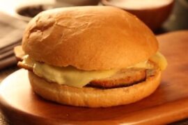 Chilean diplomático sandwich on pan frica with thin pork loin and melted chanco cheese