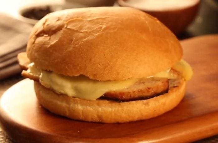 Chilean diplomático sandwich on pan frica with thin pork loin and melted chanco cheese