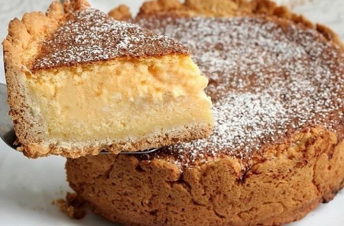 Chilean kuchen de quesillo with tender dough and fresh cheese and raisin filling