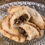 Chilean fried empanadas filled with llama charqui