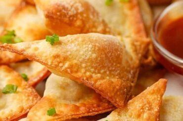 Crispy fried wontons filled with pork and shrimp, served with sweet and sour sauce