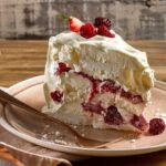 Chilean frozen raspberry meringue cake with whipped cream layers
