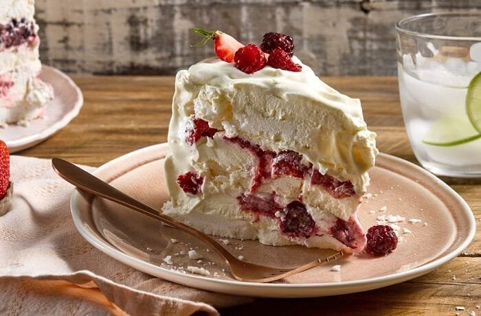 Chilean frozen raspberry meringue cake with whipped cream layers