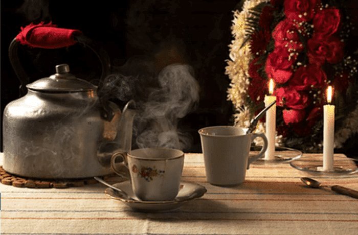 Chilean gloriao, a hot drink of aguardiente and coffee served in a kettle and china cups