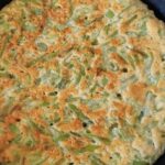 Chilean green bean tortilla with a golden surface served on a plate