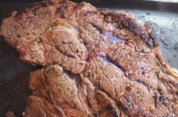 Chilean grilled abastero beef, sliced on a board
