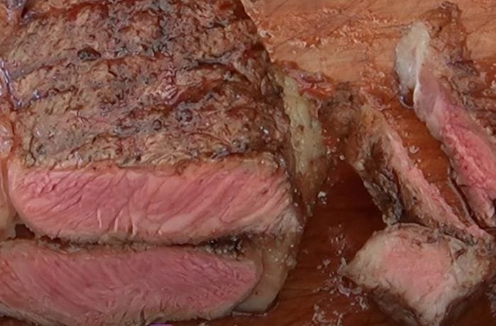 Chilean lomo liso a la parrilla, grilled sirloin cut into juicy steaks with coarse salt