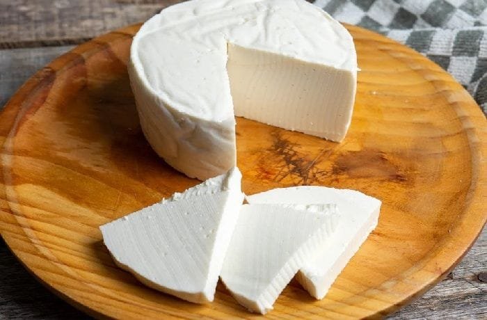 Chilean homemade queso fresco, white and creamy, served with bread and jam