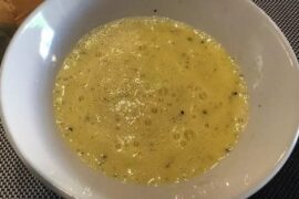 Chilean huevos a la ostra served in a bowl, a raw egg and lime mixture.