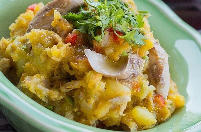 Chilean canned jack mackerel charquican with mashed potato and squash, topped with a fried egg