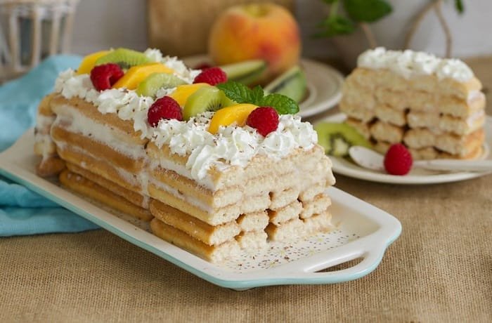 Chilean ladyfinger cake, layers of coffee soaked champagne biscuits with condensed milk cream and meringue