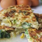 Golden lettuce and egg tortilla cut into portions