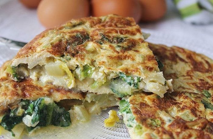 Golden lettuce and egg tortilla cut into portions