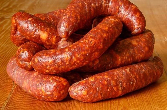 Homemade Chilean longanizas de Chillan, tied and ready, a traditional pork sausage.