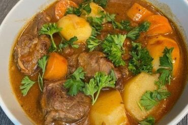 Magallanes lamb cazuela with potatoes, squash, and broth in a traditional clay pot