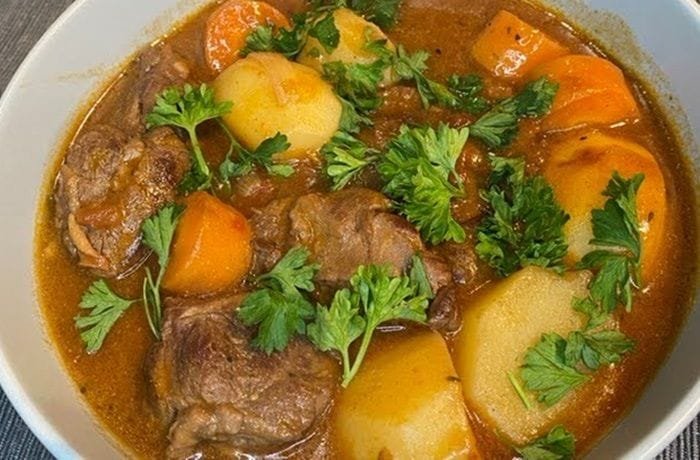 Magallanes lamb cazuela with potatoes, squash, and broth in a traditional clay pot
