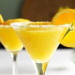 Chilean mango sour cocktail in a sugar-rimmed martini glass