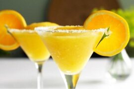 Chilean mango sour cocktail in a sugar-rimmed martini glass