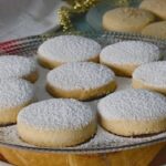 Chilean mantecados dusted with powdered sugar, crumbly lard shortbread cookies