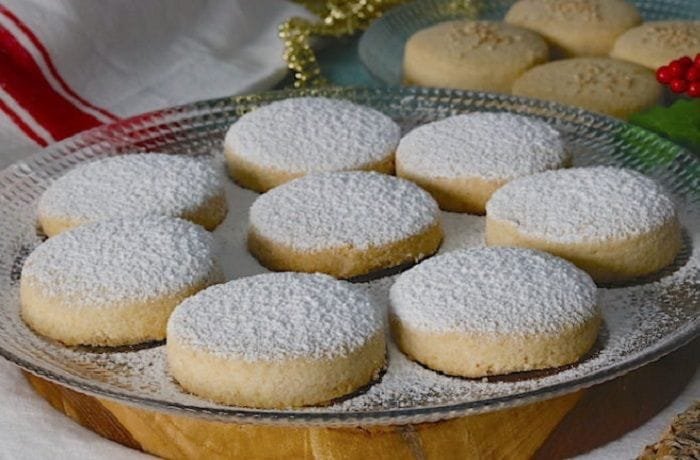 Chilean mantecados dusted with powdered sugar, crumbly lard shortbread cookies