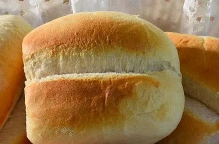 Chilean marraqueta bread rolls, ready to be soaked in milk for the loaf's base.