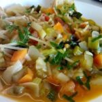 Chilean menestron recipe: thick soup with noodles, potatoes, and beans, served in a bowl.