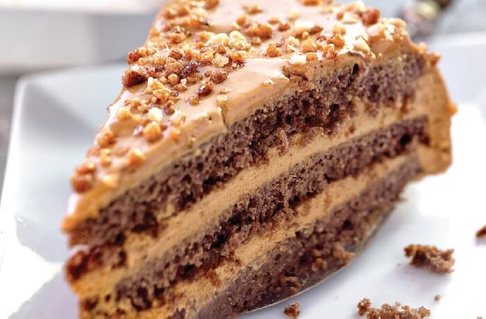 Chilean mocha cream cake layered with manjar and decorated with walnuts