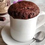 Chocolate microwave mug cake, ready and warm, straight out of the microwave.