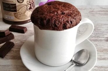 Chocolate microwave mug cake, ready and warm, straight out of the microwave.